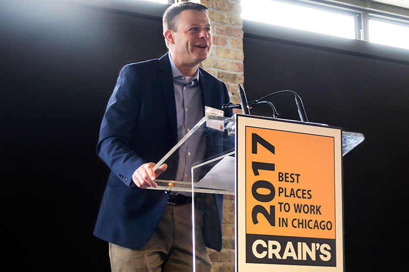 Rick Rietz accepts DMC's Best Places to Work in Chicago award