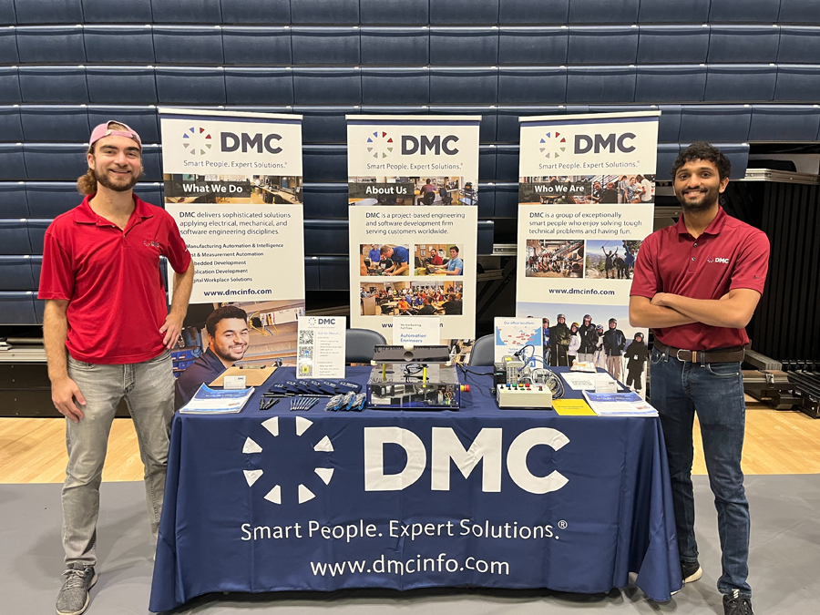 Two DMC employees at a career fair booth