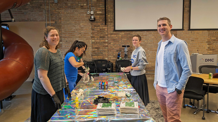 Employees tie-dyeing bags in Chicago